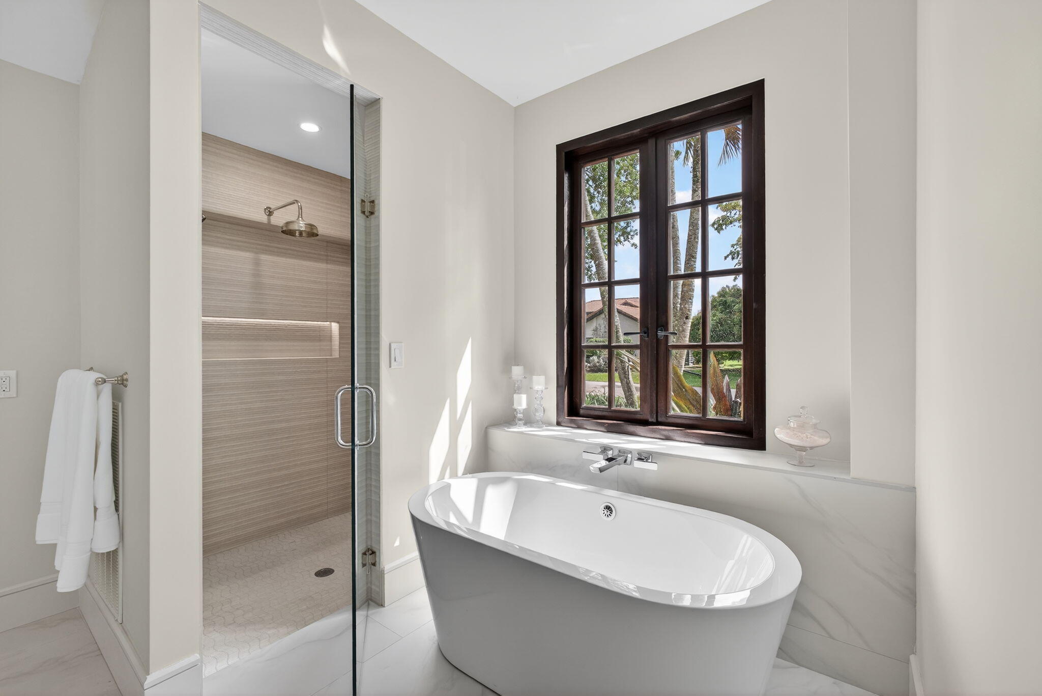 17 Carrick Road Palm Beach Gardens, FL 33418 - Photo 25 of 54 a bathroom with a bathtub and shower