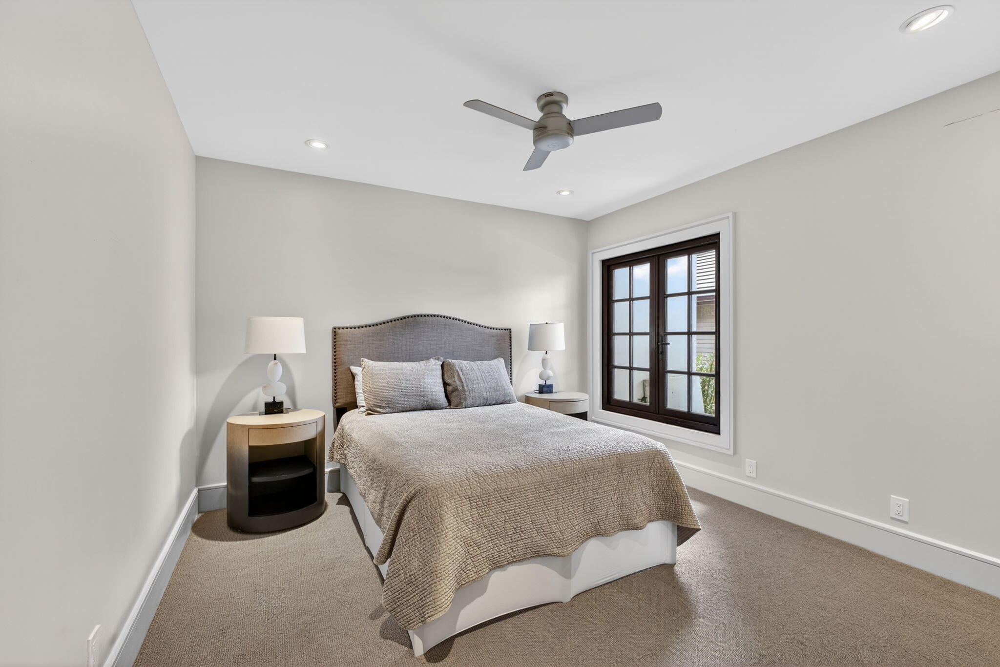 17 Carrick Road Palm Beach Gardens, FL 33418 - Photo 27 of 54 a bedroom with a large bed and a window