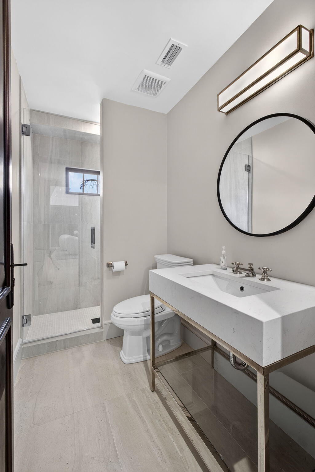 17 Carrick Road Palm Beach Gardens, FL 33418 - Photo 33 of 54 a bathroom with a sink toilet and shower