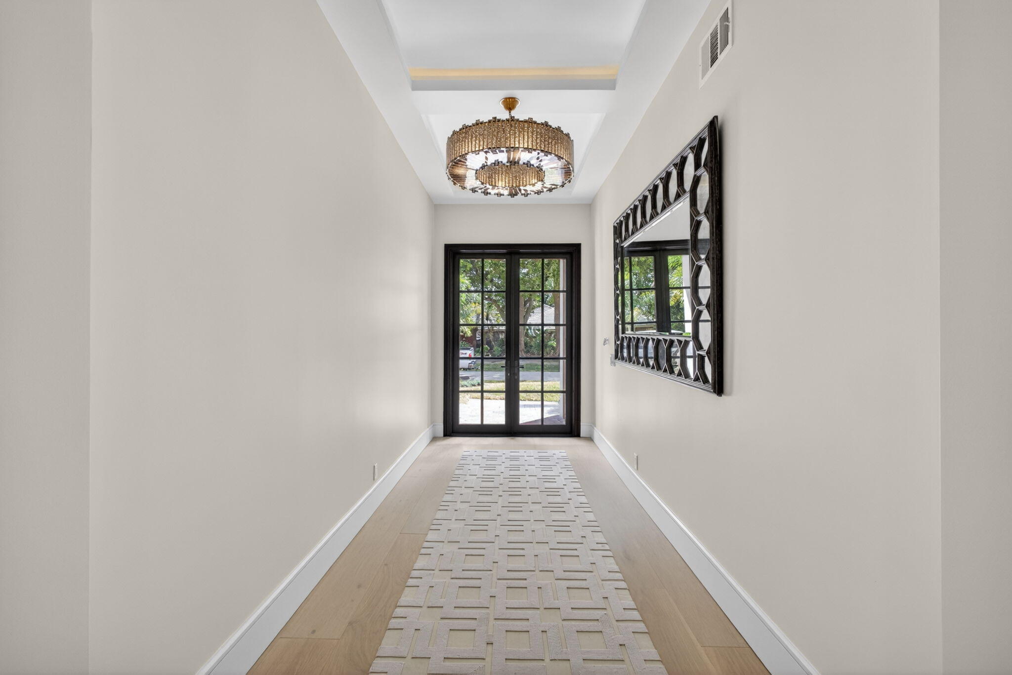 17 Carrick Road Palm Beach Gardens, FL 33418 - Photo 38 of 53 a view of a hallway with a window