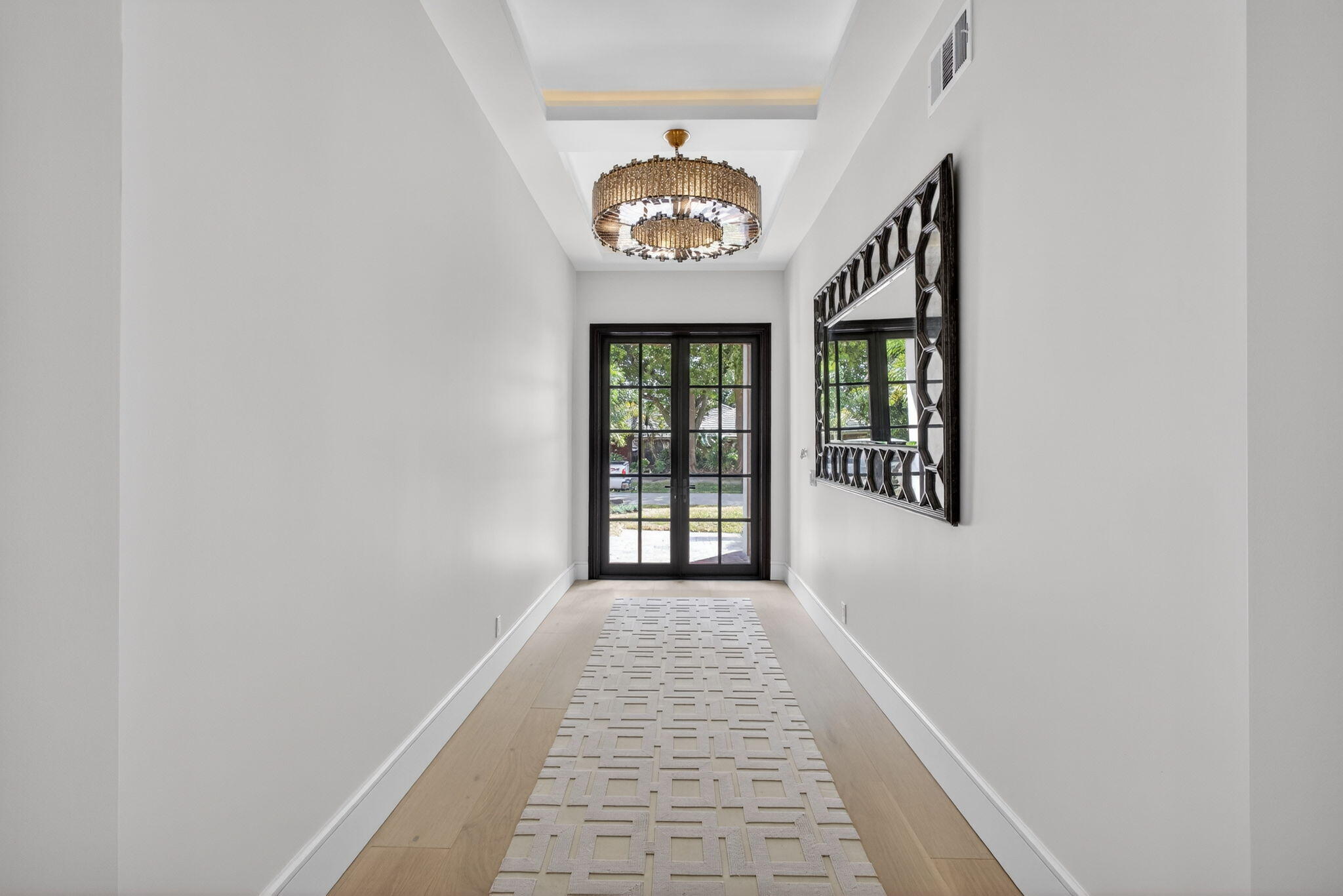 17 Carrick Road Palm Beach Gardens, FL 33418 - Photo 39 of 54 a view of a hallway with a window