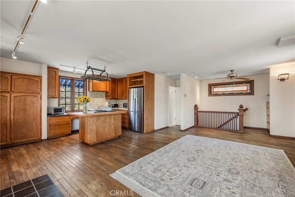 335 Rainbow Crest Road Fallbrook, CA 92028 - Photo 12 of 24 a view of a kitchen with furniture and wooden floor