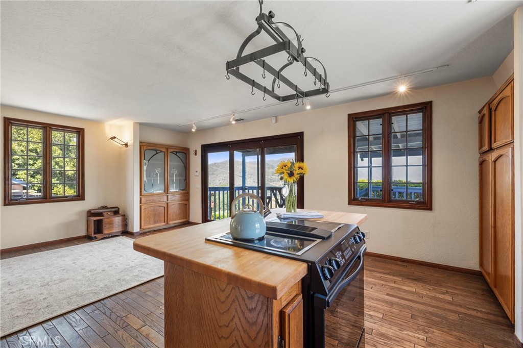 335 Rainbow Crest Road Fallbrook, CA 92028 - Photo 15 of 24 a view of a dining room with furniture window and wooden floor