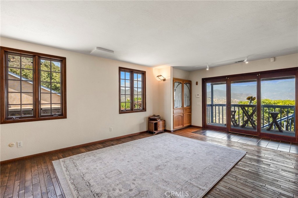 335 Rainbow Crest Road Fallbrook, CA 92028 - Photo 17 of 24 wooden floor in an empty room with a window