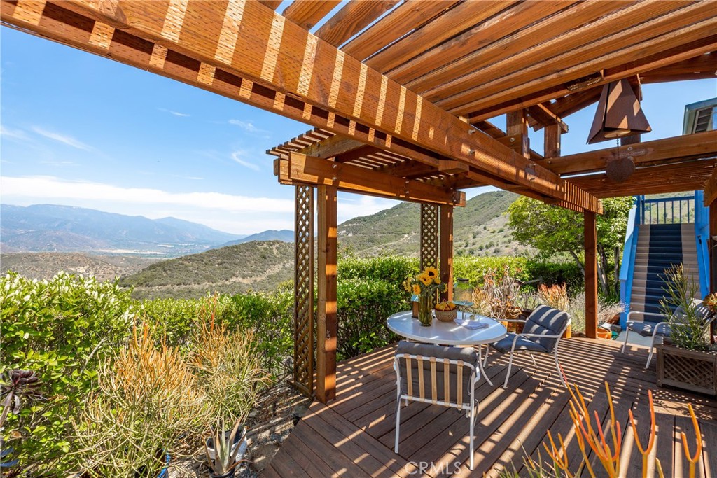 335 Rainbow Crest Road Fallbrook, CA 92028 - Photo 21 of 24 a view of a patio with a table chairs and a table