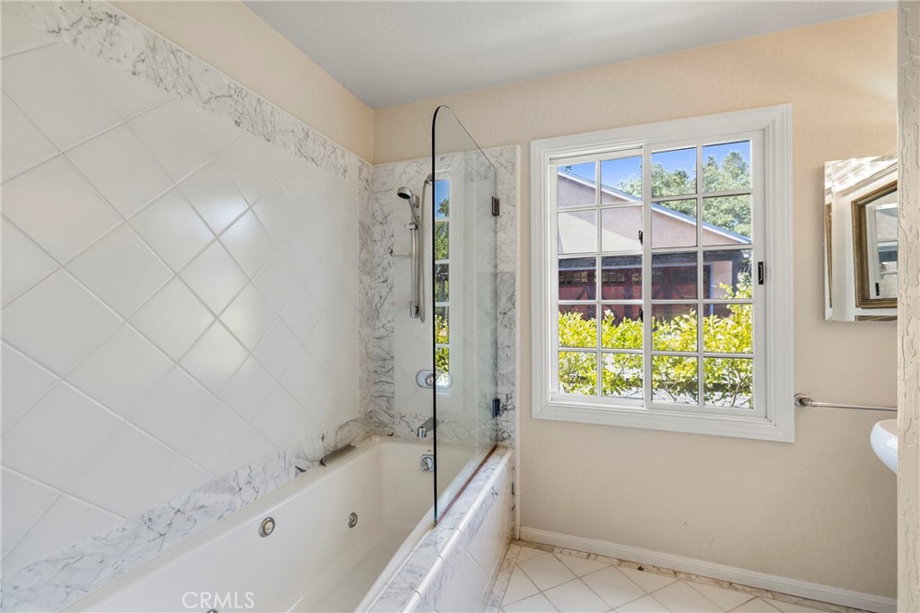 335 Rainbow Crest Road Fallbrook, CA 92028 - Photo 9 of 24 a bathroom with a bathtub and a shower