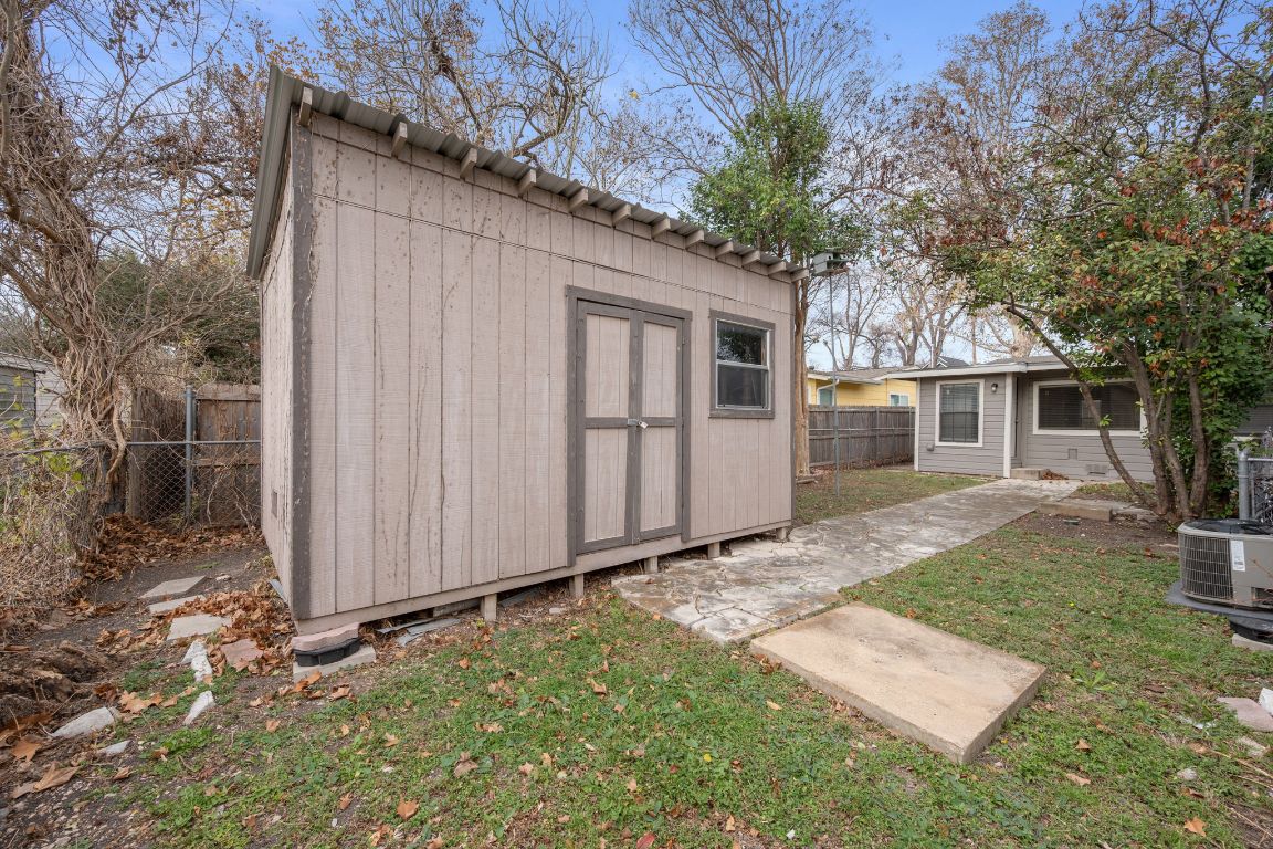 303 Irma Drive, Unit A Austin, TX 78752 - Photo 25 of 35 View of shed featuring a fenced backyard