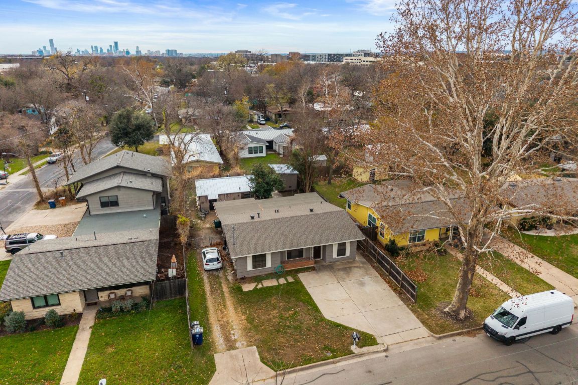 303 Irma Drive, Unit A Austin, TX 78752 - Photo 27 of 35 Aerial view of residential area featuring city skyline