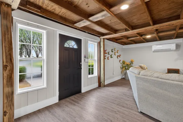 a bedroom with bunk bed and a window