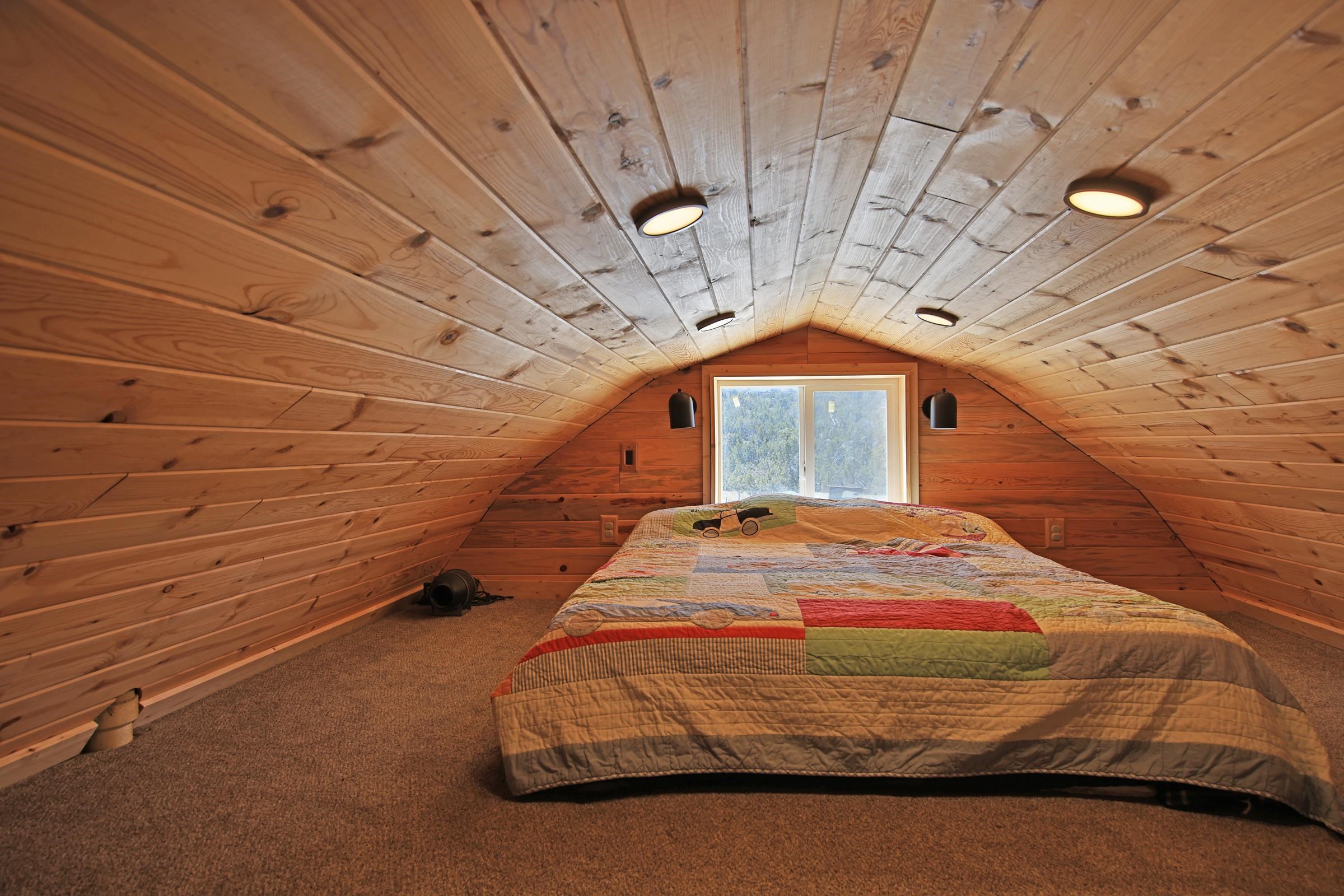 56001 KK Road Molina, CO 81646 - Photo 16 of 42 a bedroom with a bed and a window