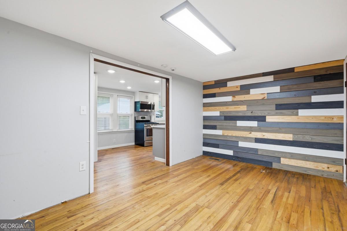 296 Kings Road Milledgeville, GA 31061 - Photo 11 of 36 a view of room with wooden floor