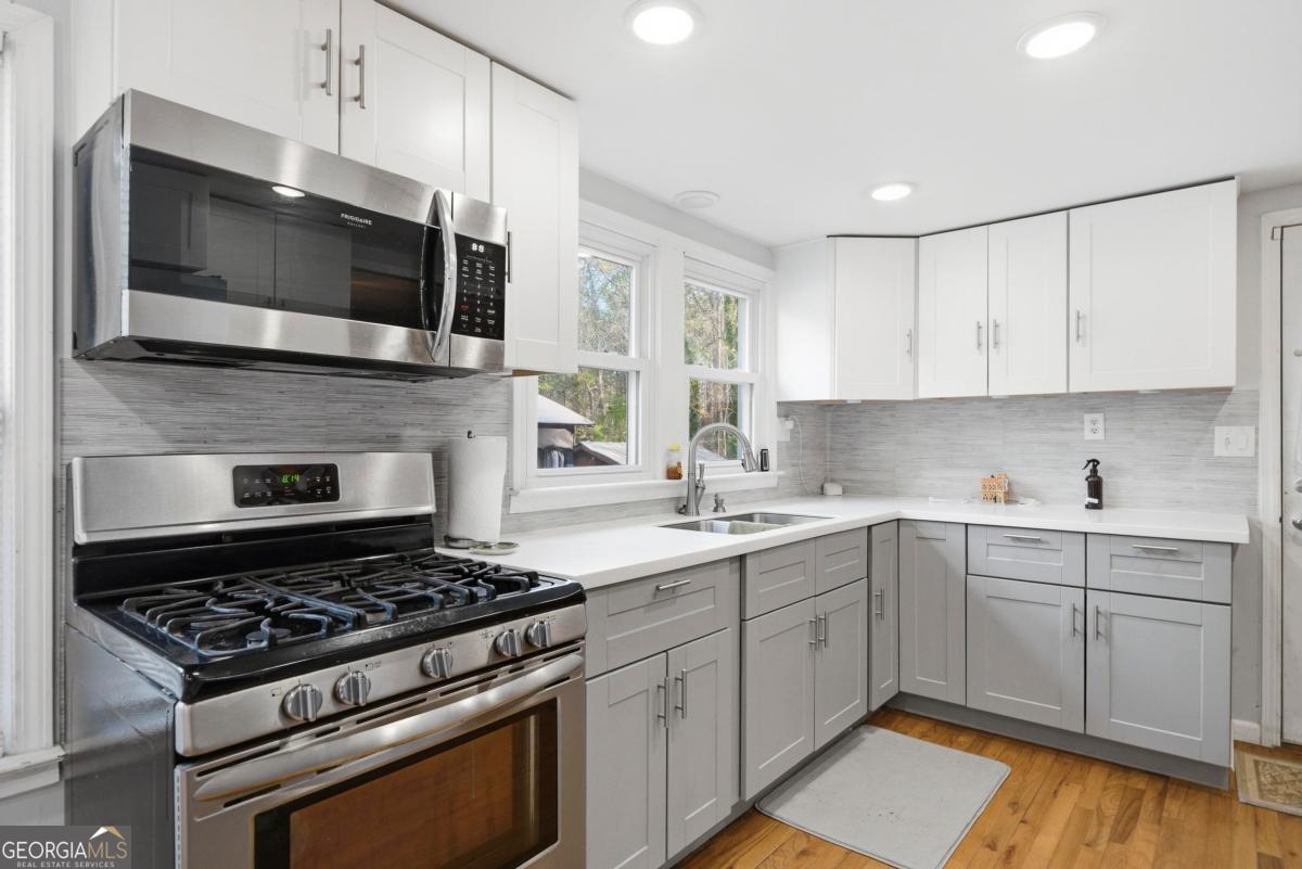 296 Kings Road Milledgeville, GA 31061 - Photo 14 of 36 a kitchen with a sink and steel appliances