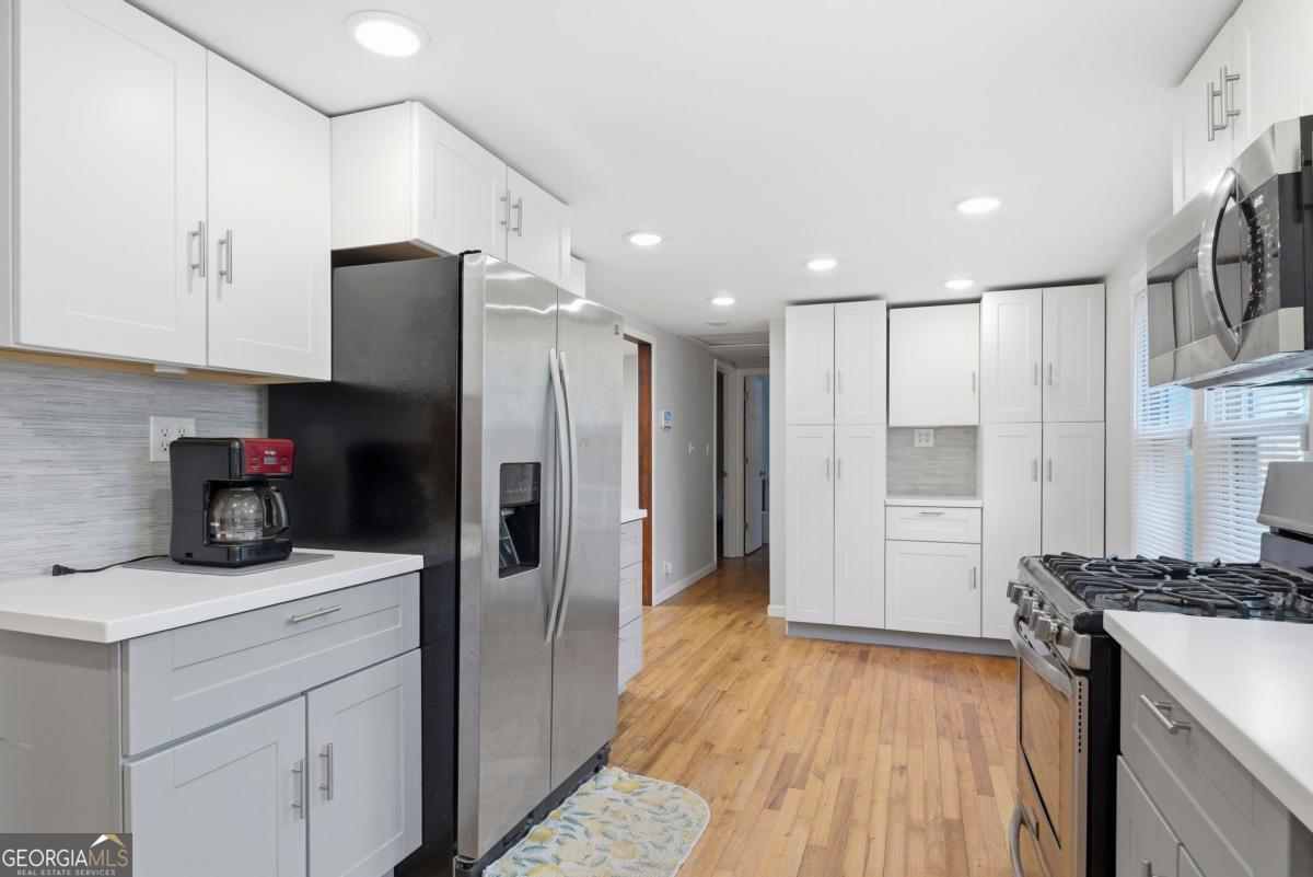 296 Kings Road Milledgeville, GA 31061 - Photo 17 of 36 a kitchen with a refrigerator and a sink