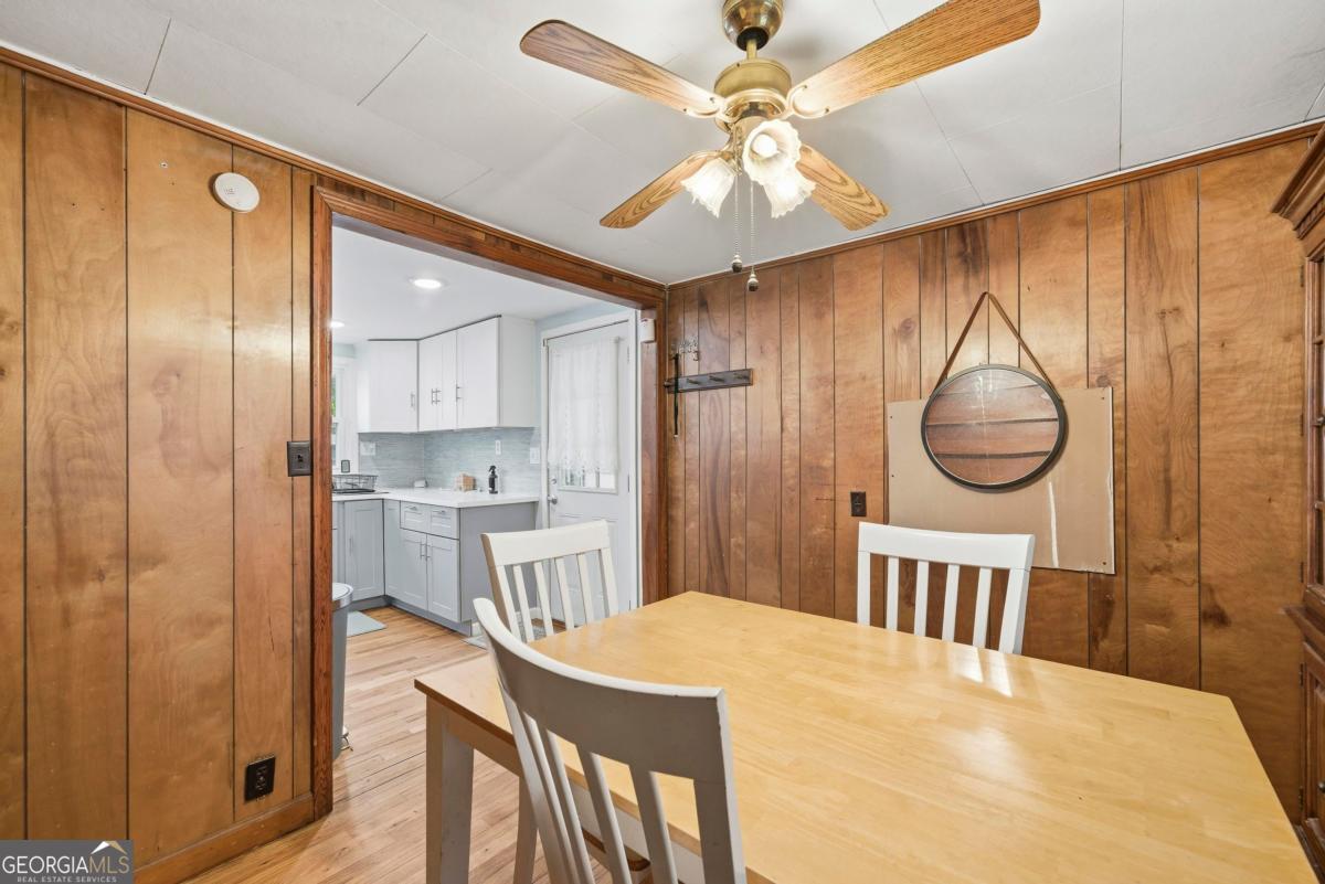 296 Kings Road Milledgeville, GA 31061 - Photo 20 of 36 a bedroom with a bed and a chandelier