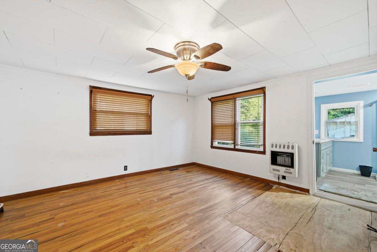 296 Kings Road Milledgeville, GA 31061 - Photo 22 of 36 a view of a livingroom with a ceiling fan window and a ceiling fan