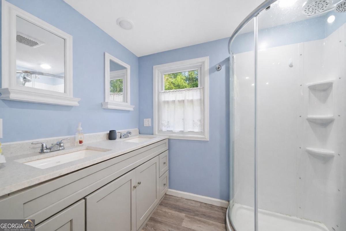 296 Kings Road Milledgeville, GA 31061 - Photo 24 of 36 a utility room with a window a sink and a mirror