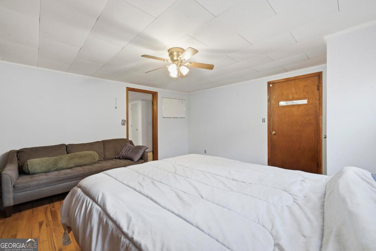 296 Kings Road Milledgeville, GA 31061 - Photo 26 of 36 a bedroom with a bed and a couch