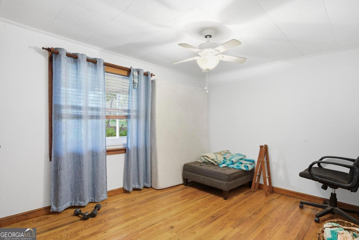 296 Kings Road Milledgeville, GA 31061 - Photo 29 of 36 a living room with couch and a wooden floor