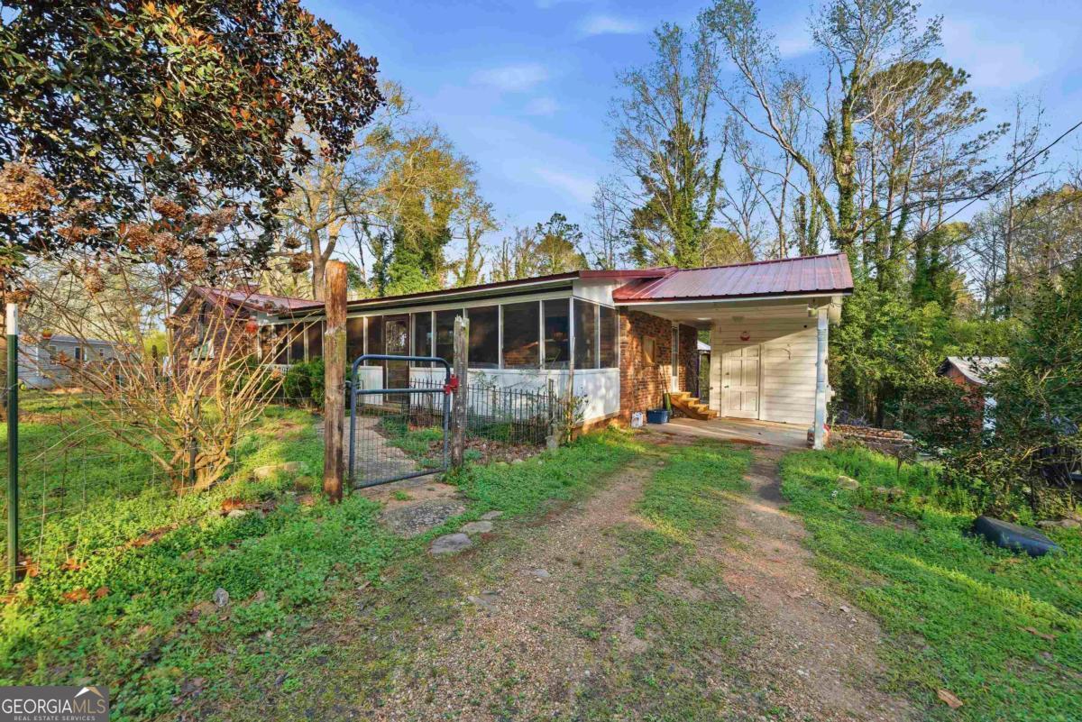 296 Kings Road Milledgeville, GA 31061 - Photo 3 of 36 a view of a house with backyard and sitting area