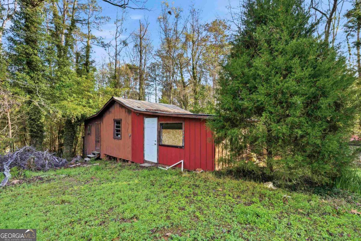 296 Kings Road Milledgeville, GA 31061 - Photo 36 of 36 a view of a wooden house with a yard