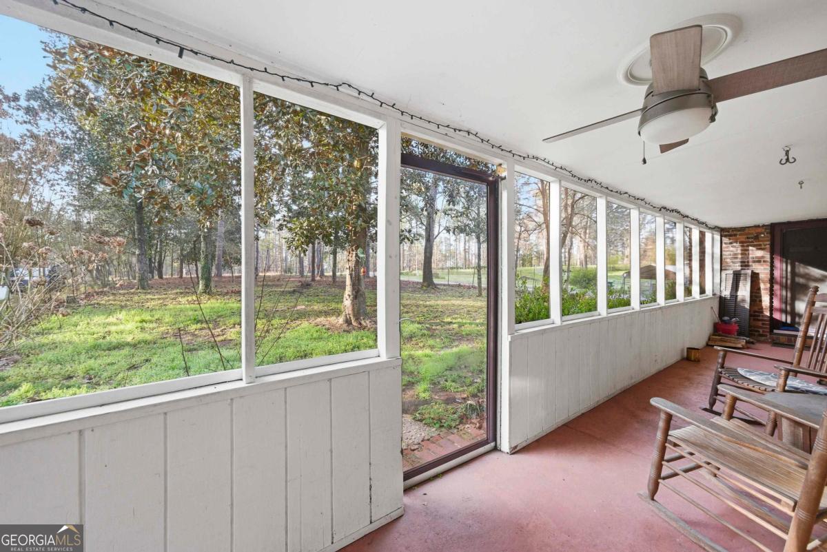 296 Kings Road Milledgeville, GA 31061 - Photo 7 of 36 a view of a porch with furniture and a yard