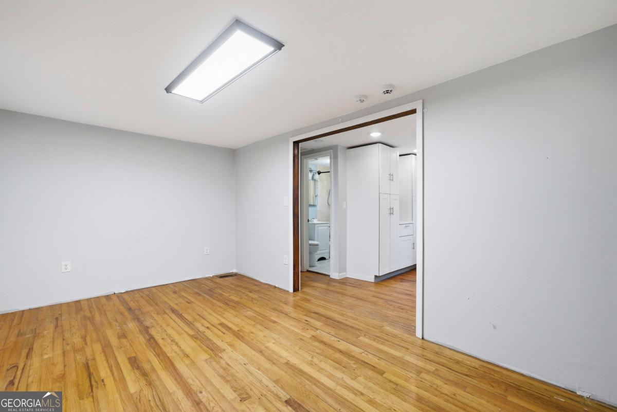 296 Kings Road Milledgeville, GA 31061 - Photo 9 of 36 wooden floor in an empty room