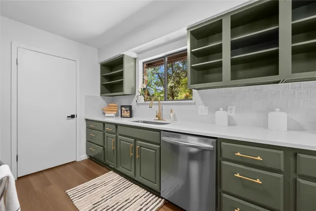 a kitchen with a sink and a window