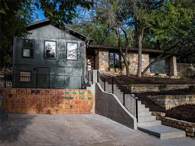 a front view of a house with garage