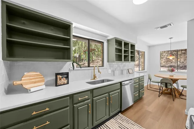 a kitchen with a sink and a window