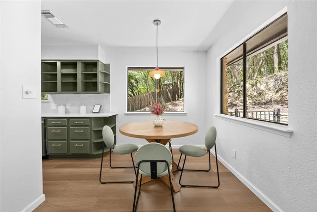 a dining room with furniture and window