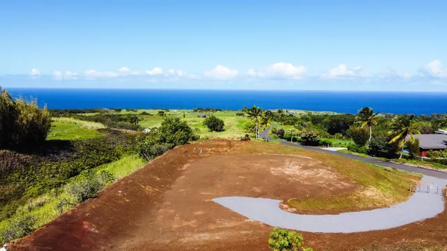 a view of a swimming pool with an outdoor space and seating area