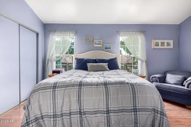 a bedroom with a bed and window