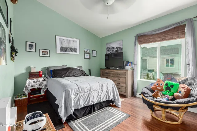 a bedroom with bed and a couch