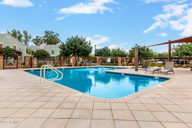 a view of a swimming pool with a lounge chairs