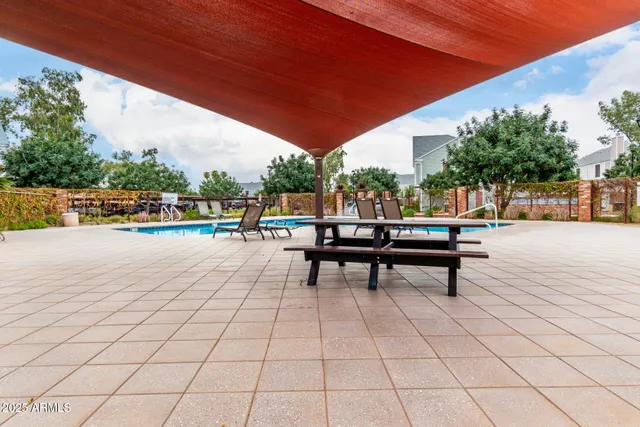 a view of a swimming pool with lounge chair