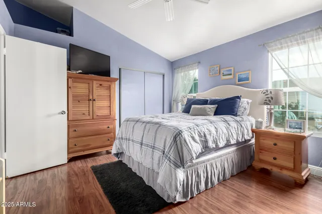 a bedroom with a bed and a dresser