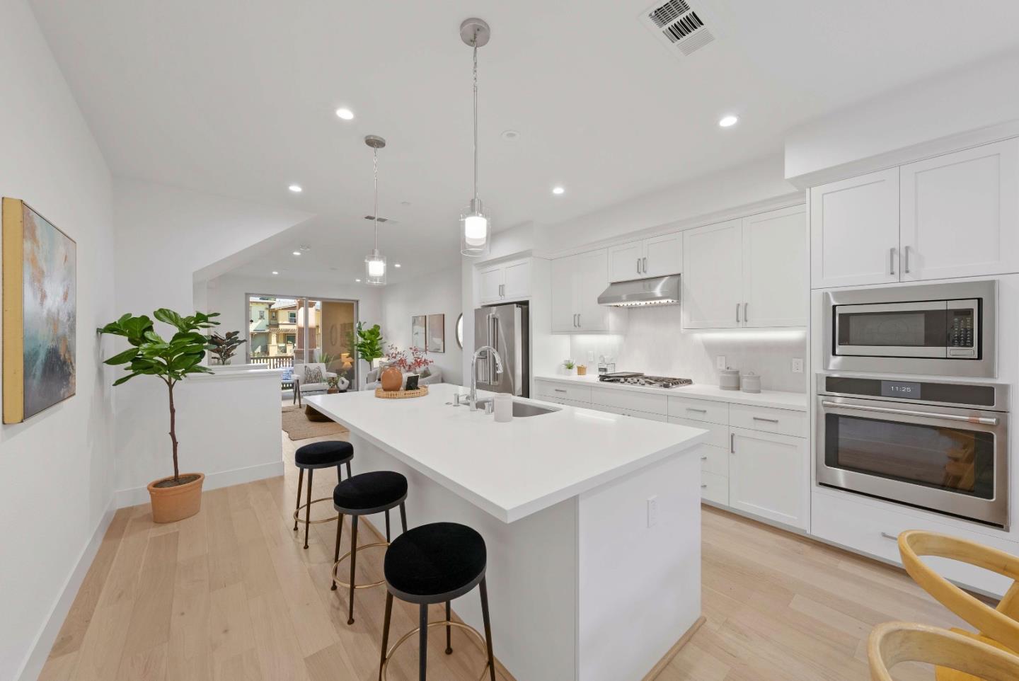 307 Marquetta Circle Mountain View, CA 94043 - Photo 13 of 38 a kitchen with a sink a stove and chairs