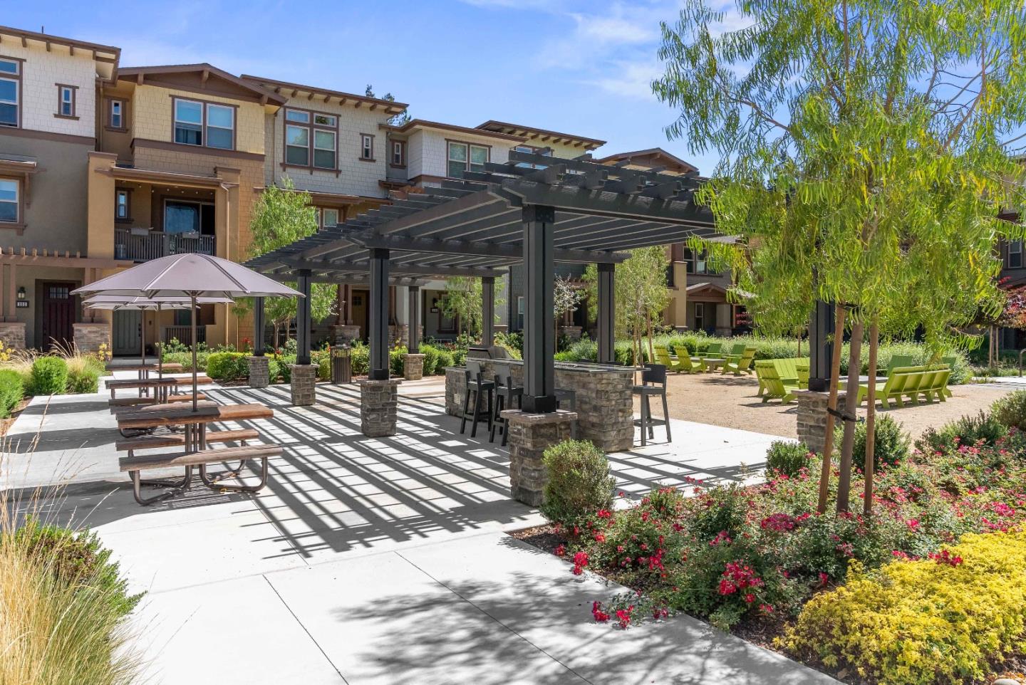 307 Marquetta Circle Mountain View, CA 94043 - Photo 2 of 38 a view of a patio with a table and chairs under an umbrella with a small yard