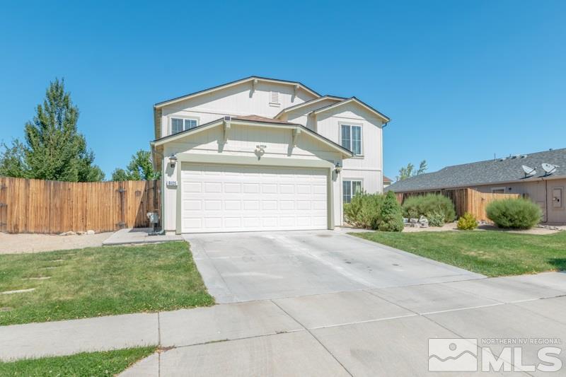 8925 Yeager Street Reno, NV 89506 - Photo 3 of 21 a front view of a house with a yard