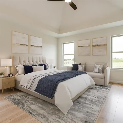 a bedroom with a large bed and a window