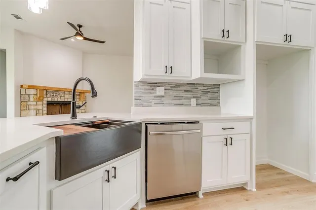 a kitchen with appliances cabinets and a sink