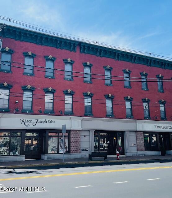 8 East Front Street, Unit 204 Red Bank, NJ 07701 - Photo 1 of 13 a front view of multi story residential apartment building