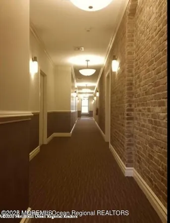 a view of an empty room with stairs