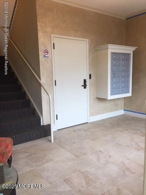 8 East Front Street, Unit 204 Red Bank, NJ 07701 - Photo 12 of 15 a view of an empty room with stairs