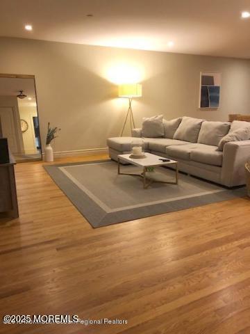 8 East Front Street, Unit 204 Red Bank, NJ 07701 - Photo 4 of 13 a living room with furniture and a flat screen tv