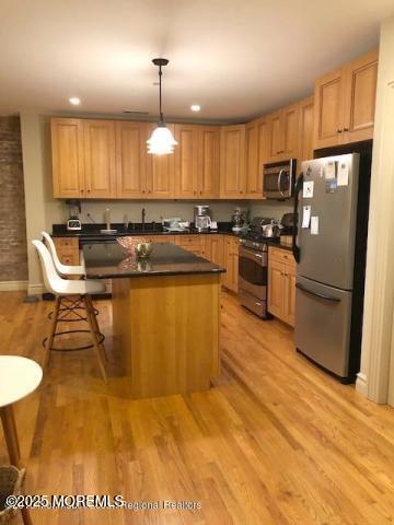 8 East Front Street, Unit 204 Red Bank, NJ 07701 - Photo 8 of 13 a kitchen with stainless steel appliances granite countertop a sink a stove a refrigerator cabinets and chairs