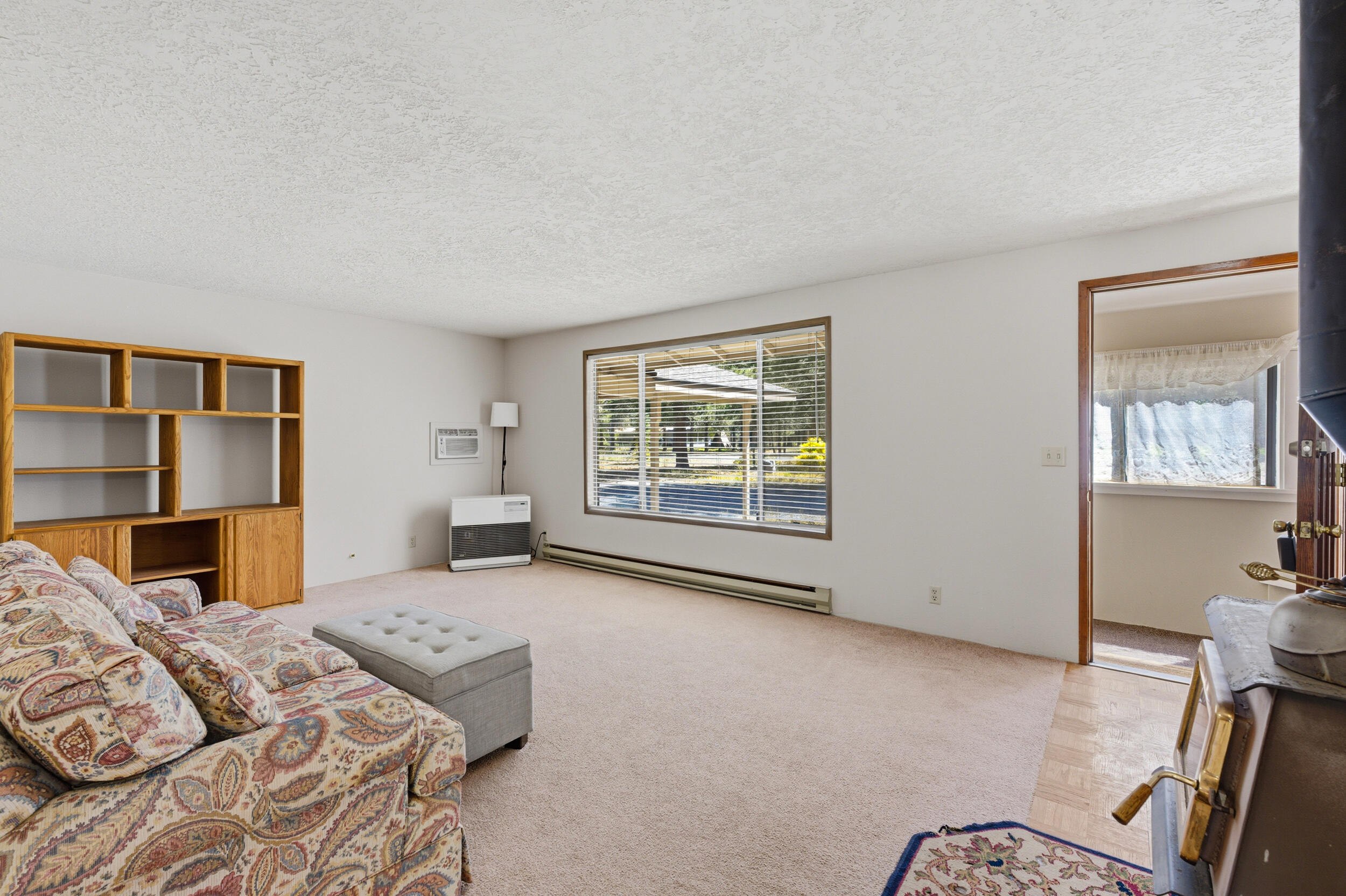50868 Doe Loop La Pine, OR 97739 - Photo 10 of 51 a bedroom with a bed and a couch next to a window