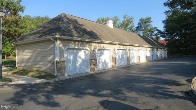 a view of a chair and table of the garden