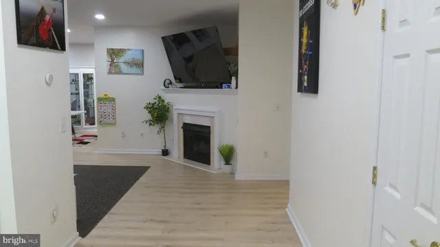 a view of living room with furniture and flat screen tv