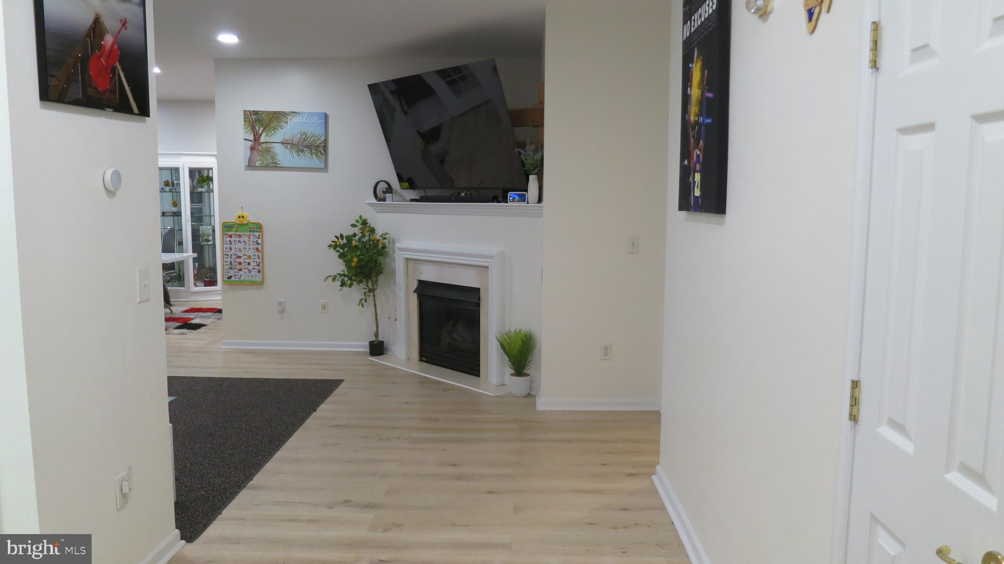 121 Kyle Way Ewing, NJ 08628 - Photo 3 of 25 a view of living room with furniture and flat screen tv